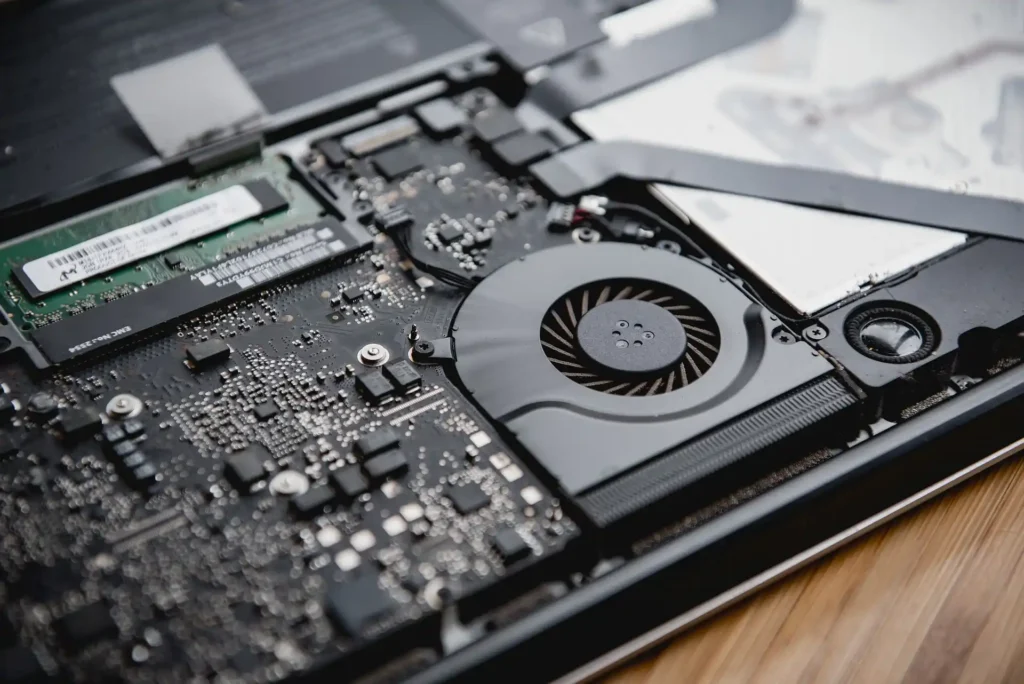 How should you clean your laptop's fan? ​